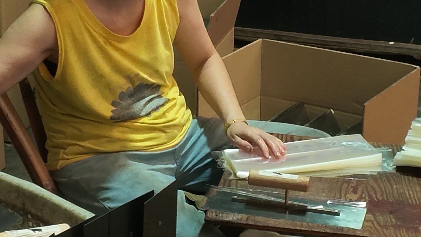 Worker packing finished tools